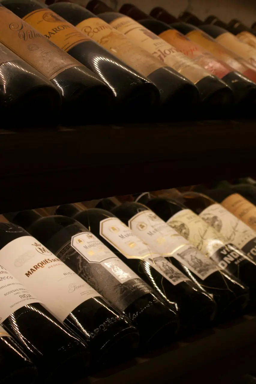 black and white bottles on brown wooden shelf